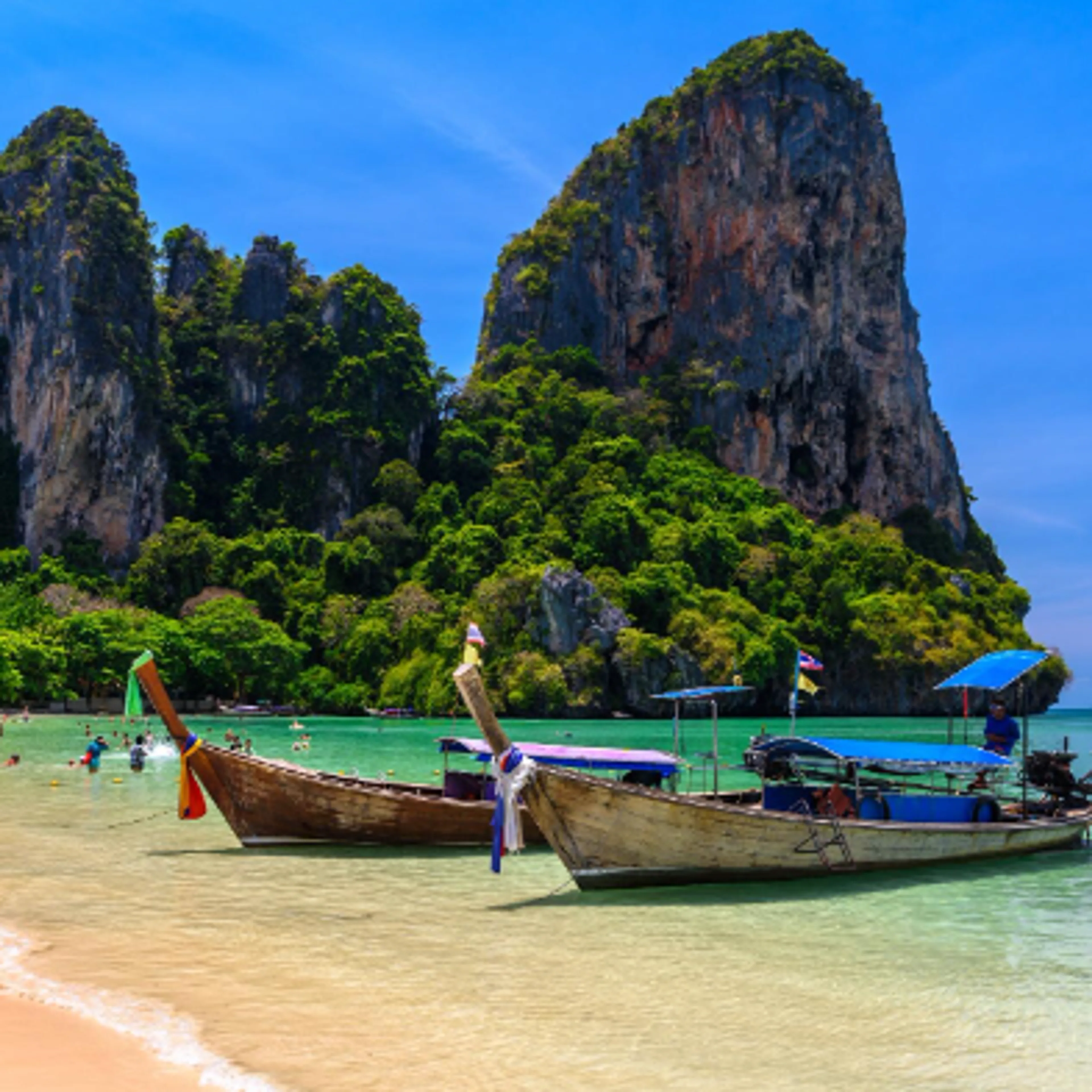 Krabi Thailand with limestone cliffs, tropical beach, and turquoise Andaman Sea
