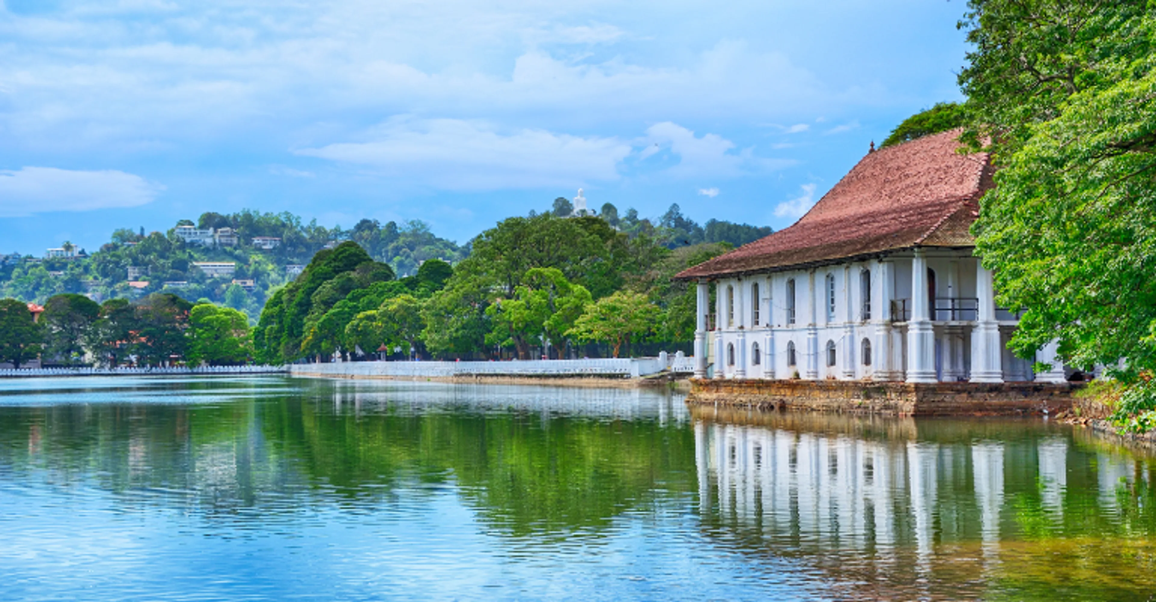 A colonial-era building reflected in Kandy Lake