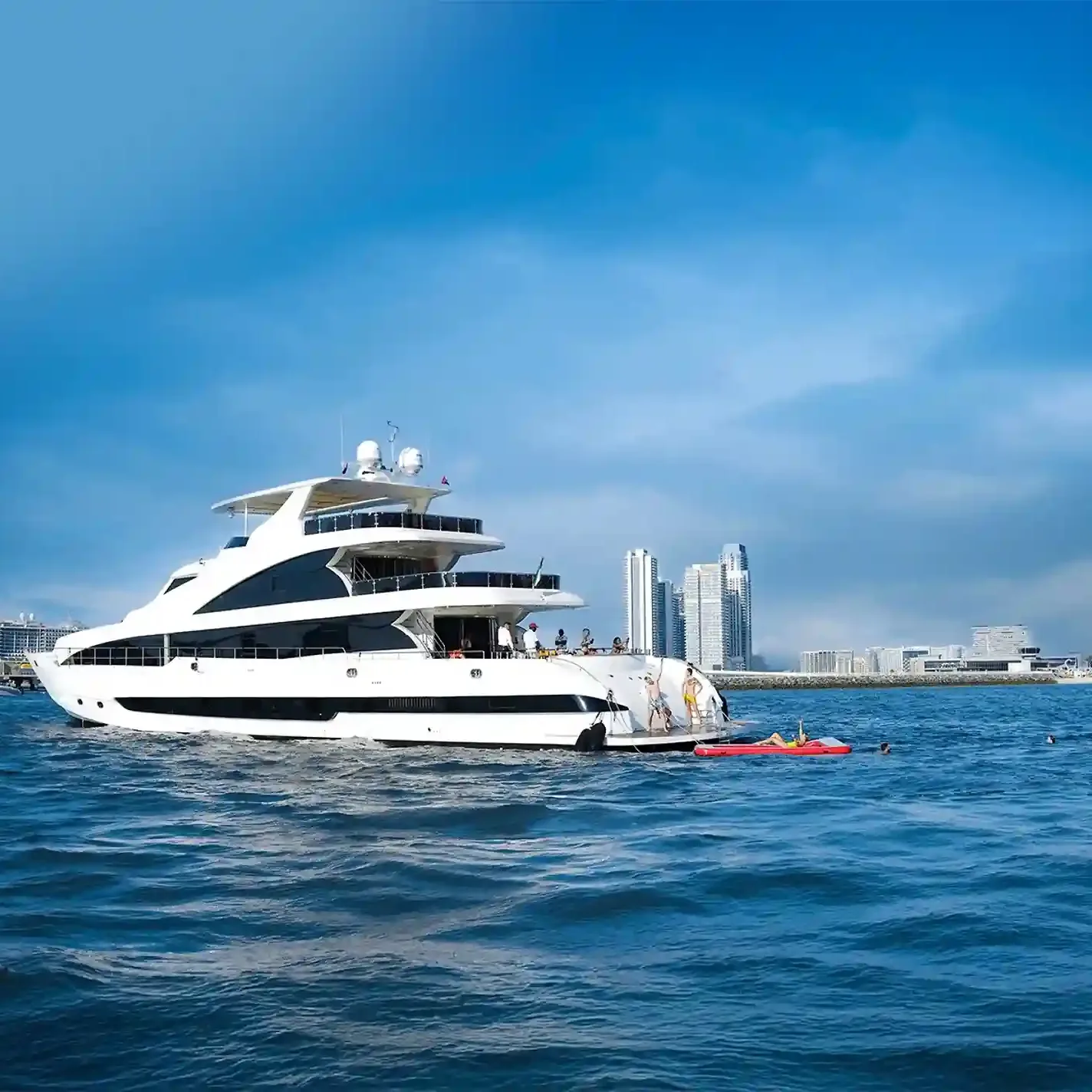 Luxury private yacht cruising along Dubai Marina skyline