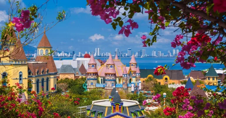 Fairytale-style towers of VinWonders Phu Quoc framed by bougainvillea