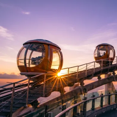 Visitors on the open-air Canton Tower Sky Walk observation deck overlooking Guangzhou skyline