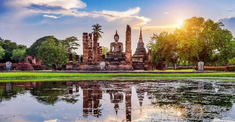 Golden temple against a Thailand skyline at dusk