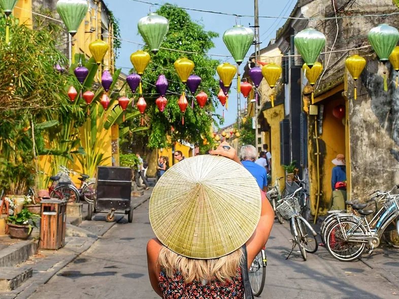 Colorful lanterns strung above Hoi An's ancient town streets