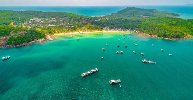 Aerial view of boats anchored in the turquoise waters off a Phu Quoc beach
