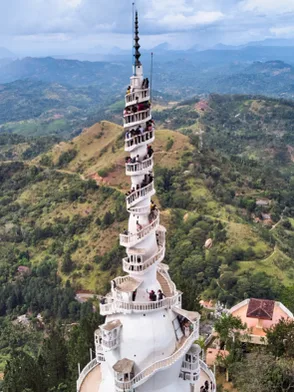 Ambuluwawa Tower rising above forests and mountain scenery