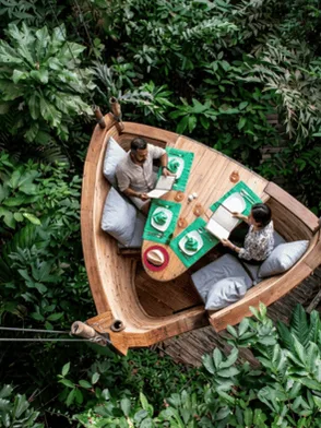 Gourmet dining suspended above the rainforest canopy in Soneva Kiri's bamboo Treepod, Trat, Thailand