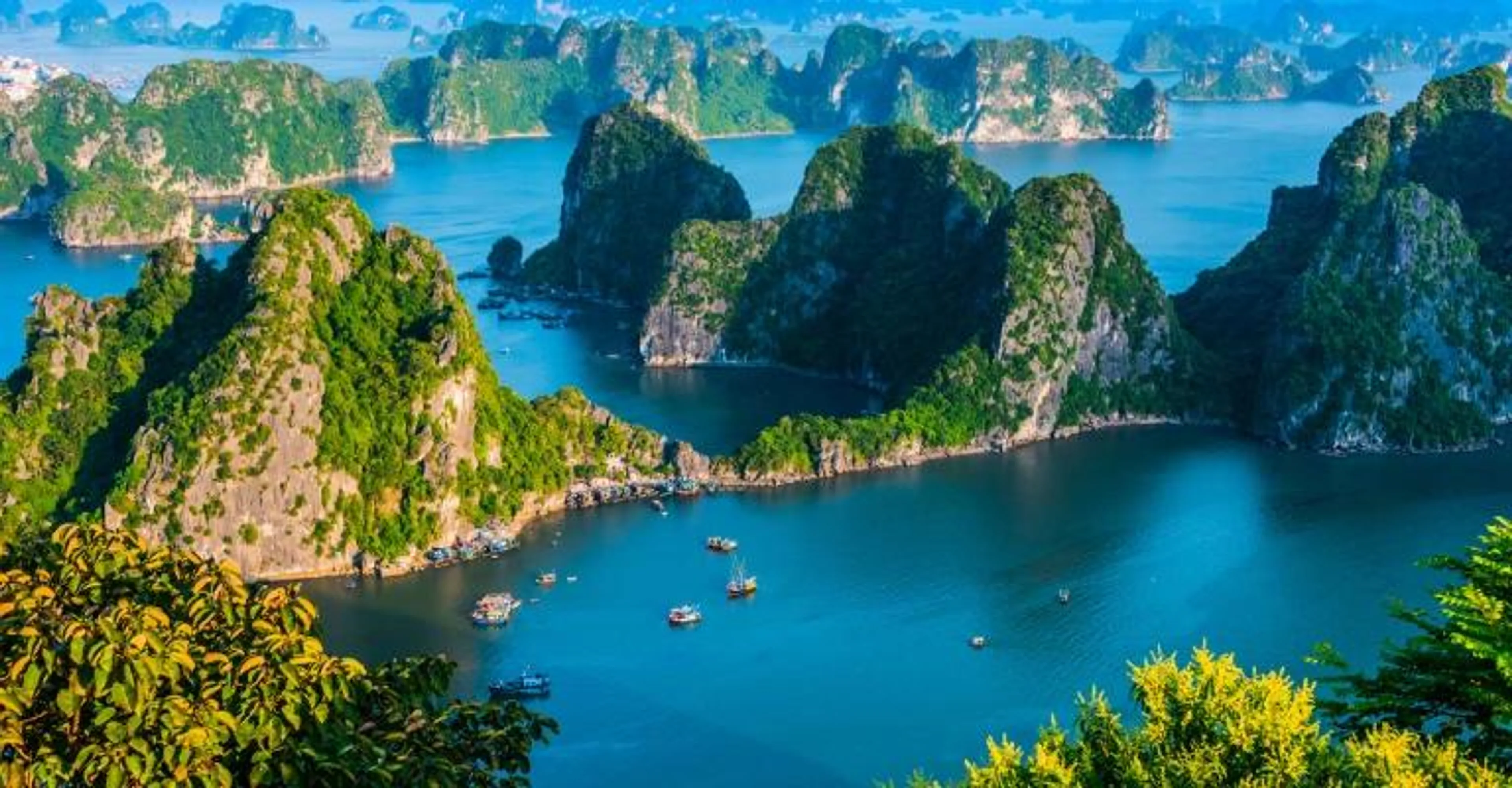 Aerial view of Halong Bay's limestone islands and boats
