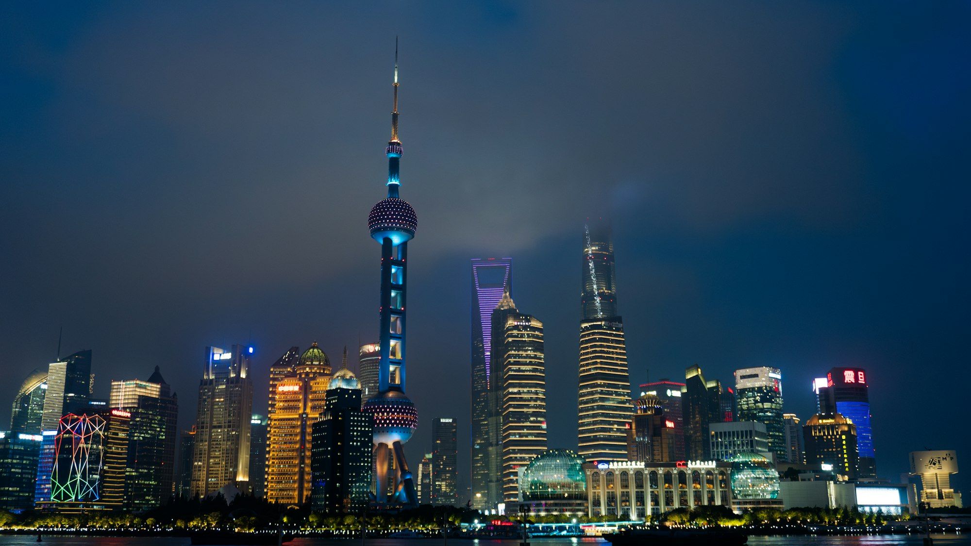 Shanghai's illuminated skyline at night, viewed from the Bund