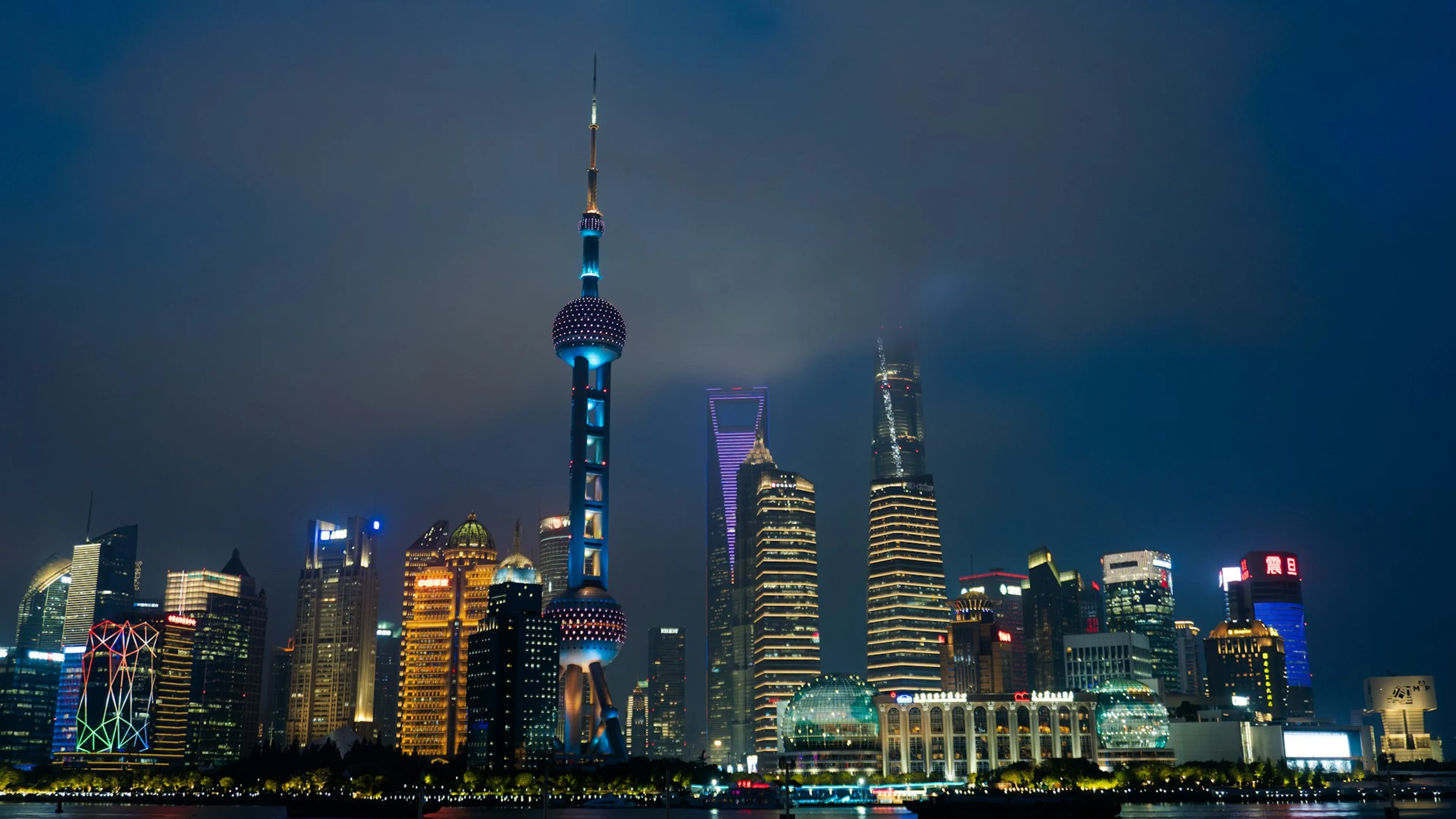 Shanghai's illuminated skyline at night, viewed from the Bund