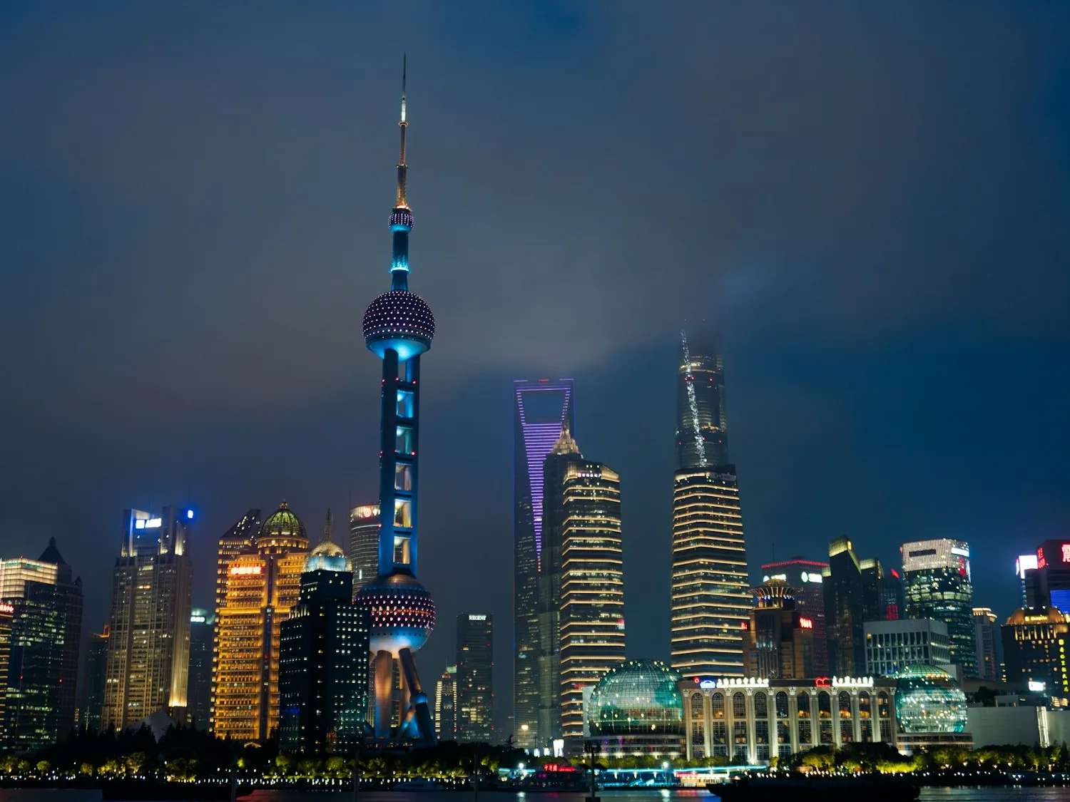 Shanghai's illuminated skyline at night, viewed from the Bund