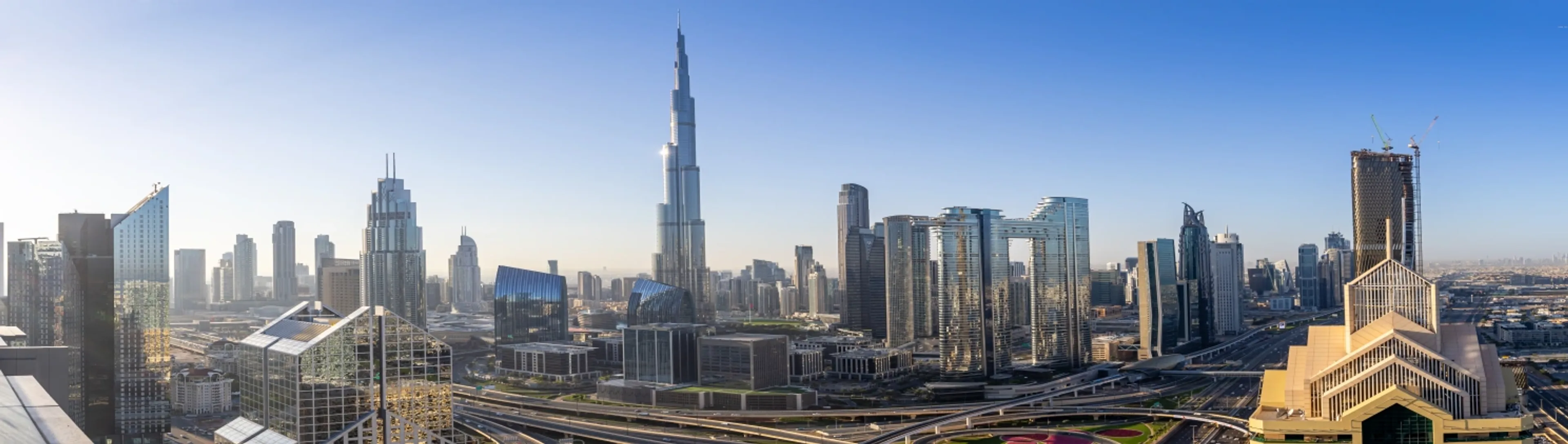 Travel agents promoting UAE tours with scenic destinations, beaches, and cultural experiences