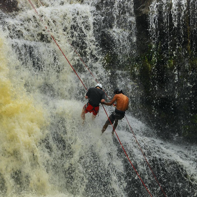 Adventurer abseiling down a waterfall during a canyoning trip in Đà Lạt Vietnam