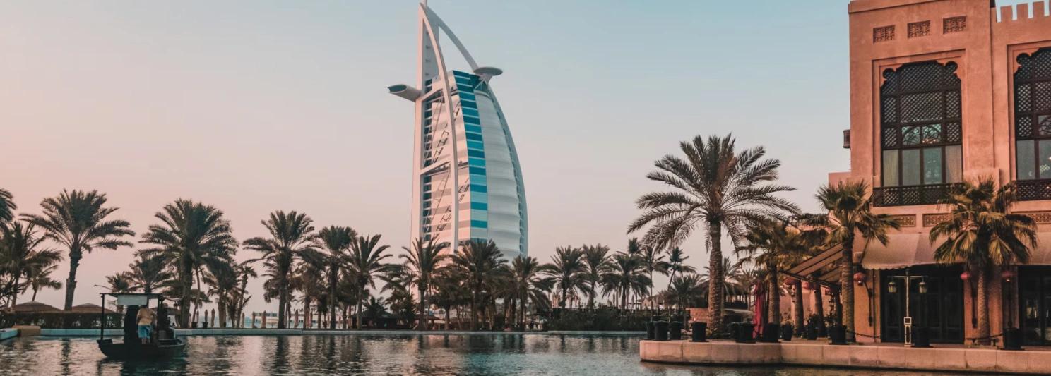 Aerial view of a coastal bridge and mountains, featured on the Dubai & Abu Dhabi Experience Tour homepage card