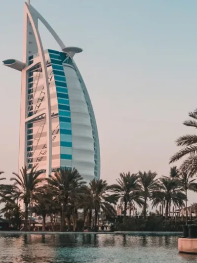 Aerial view of a coastal bridge and mountains, featured on the Dubai & Abu Dhabi Experience Tour homepage card