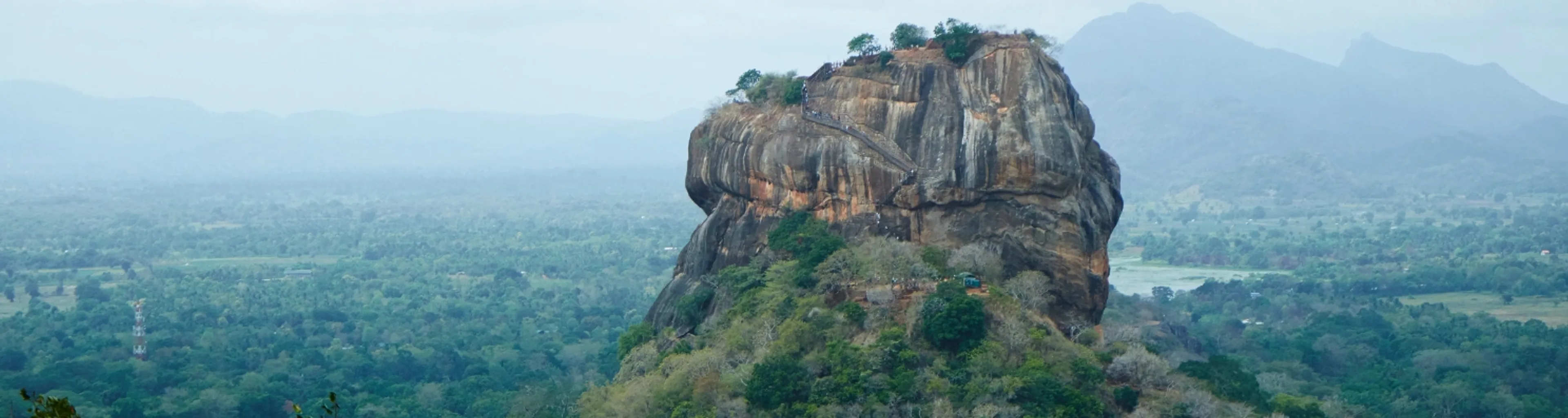 Aerial view of Sri Lanka landscape featuring lush greenery, coastline, and tropical scenery