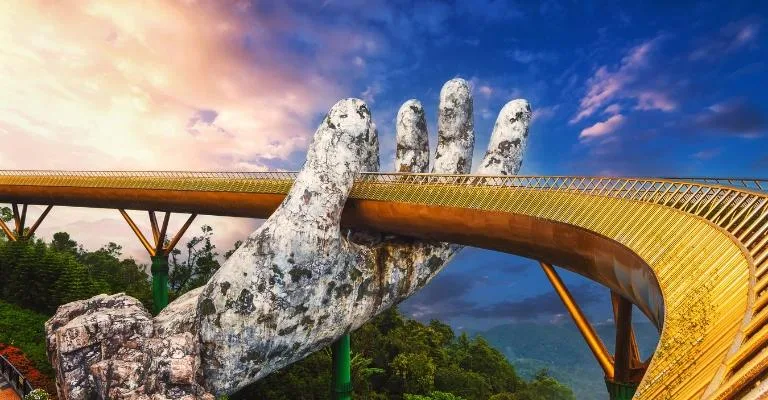 The Golden Bridge held up by giant stone hands at Bana Hills, Danang