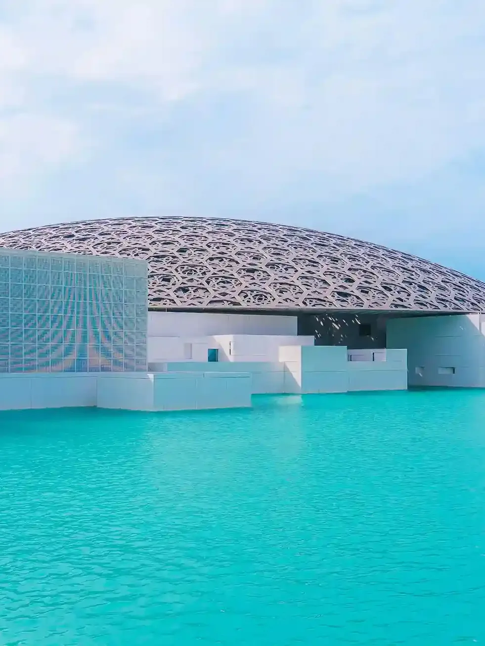 Louvre Abu Dhabi museum exterior with iconic dome architecture on Saadiyat Island