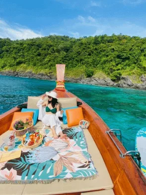 Floating breakfast served aboard a traditional Thai longtail boat in Phang Nga Bay, Thailand