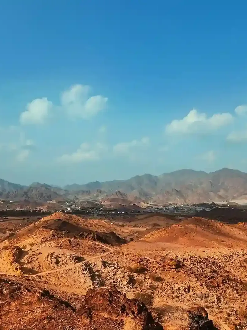 Hatta mountains landscape with kayaking lake and rugged terrain