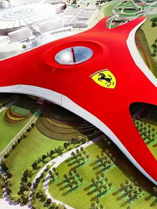 Ferrari World Abu Dhabi theme park with red roof structure and roller coasters