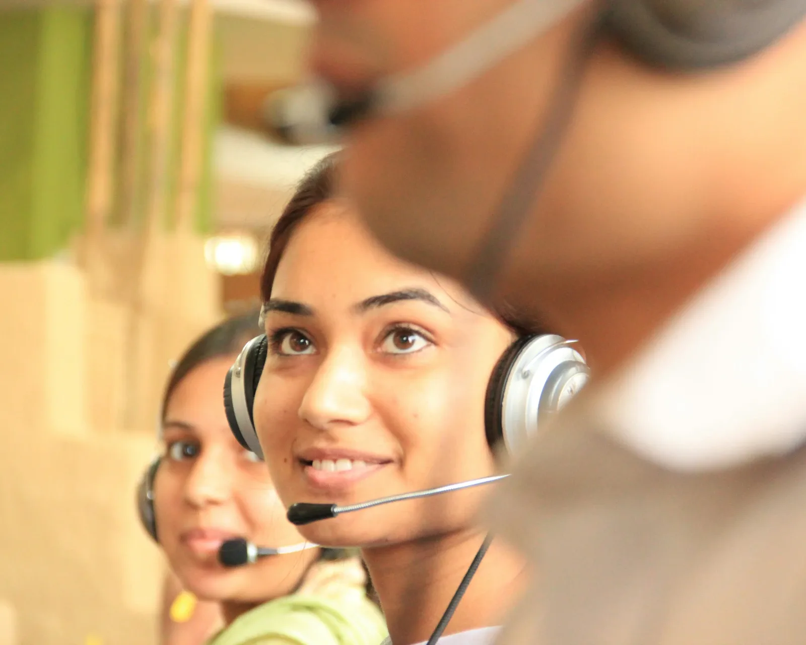 Royal Arabian travel advisor assisting a customer over a headset
