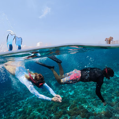 Scuba diver exploring vibrant coral reefs in the clear waters of Nha Trang Vietnam