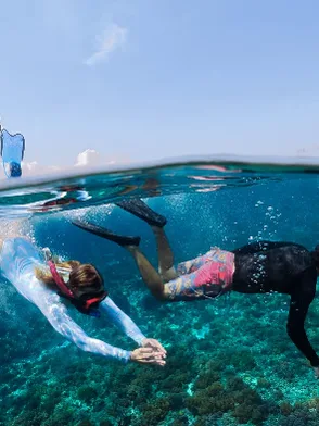 Scuba diver exploring vibrant coral reefs in the clear waters of Nha Trang Vietnam