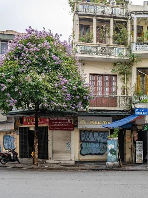 Hanoi Old Quarter with busy streets, local shops, and vibrant city life