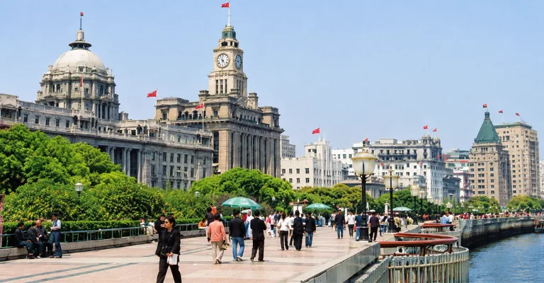 Historic Bund waterfront promenade in Shanghai lined with colonial-era buildings