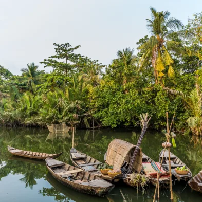 Mekong Delta boat tour with floating villages and tropical river landscapes