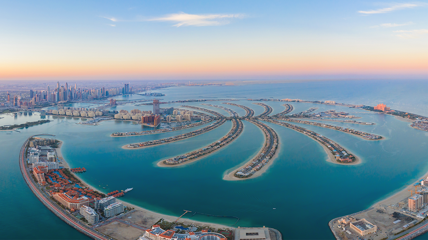 Aerial view of Palm Jumeirah and the Dubai skyline at sunset