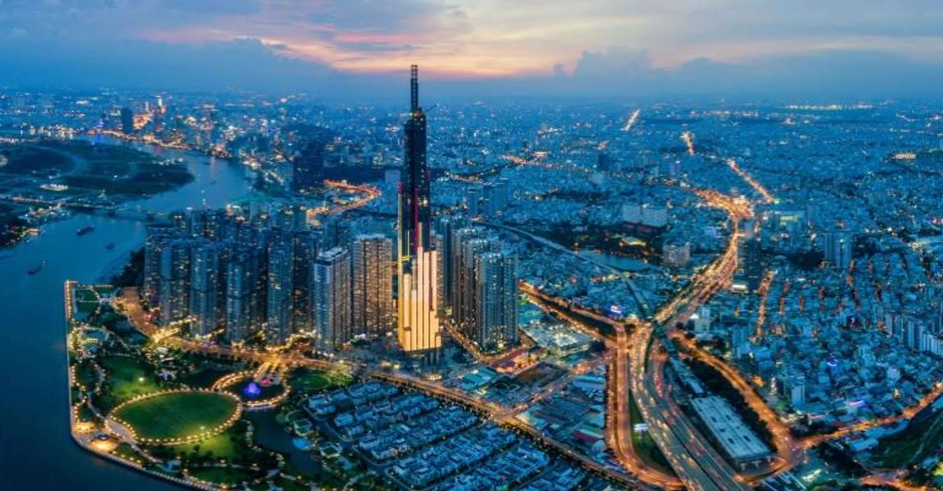 Aerial view of Ho Chi Minh City's skyline and highways lit up at dusk