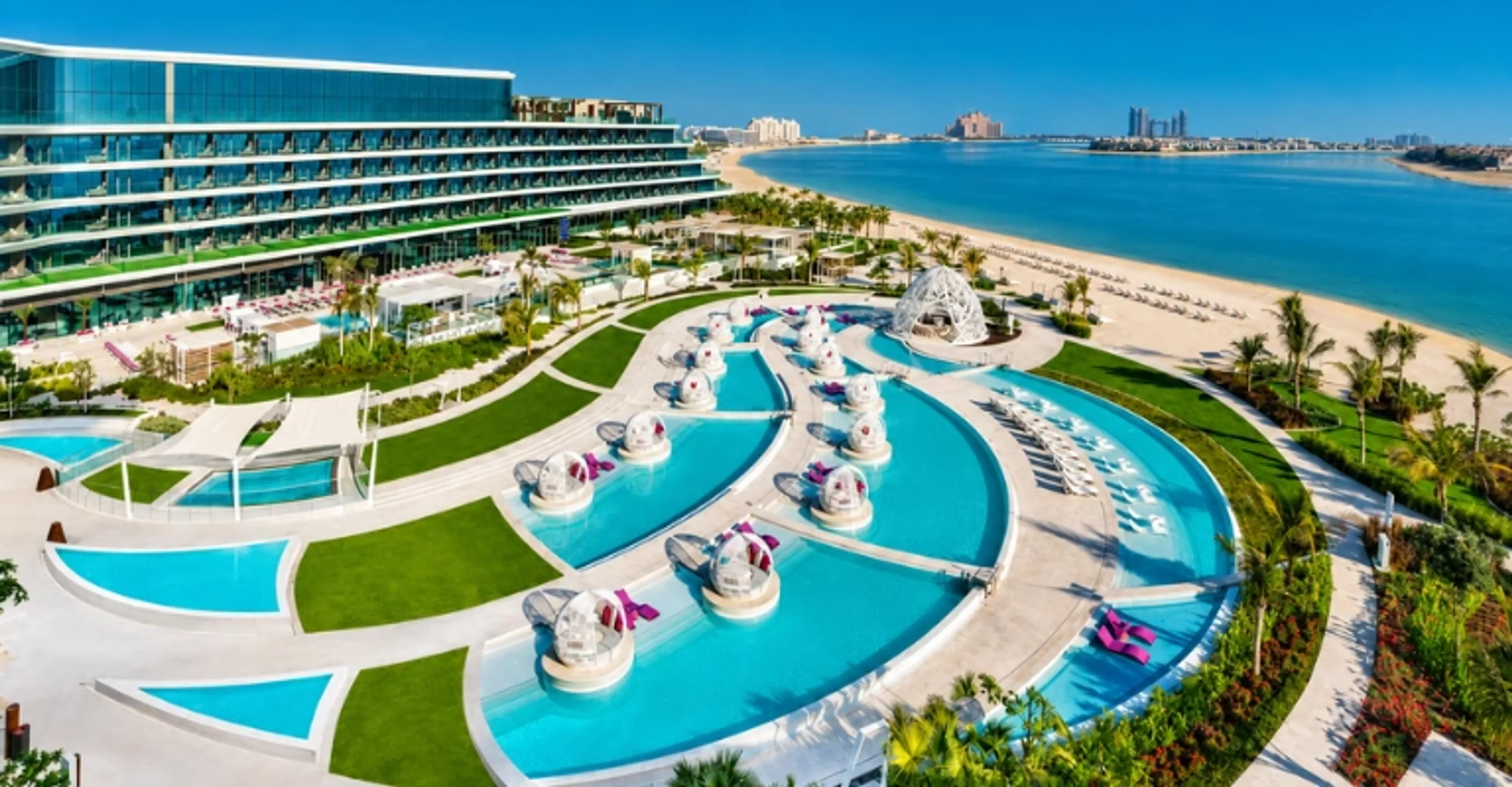 Luxury beachfront resort on Palm Jumeirah with pools and Arabian Gulf views