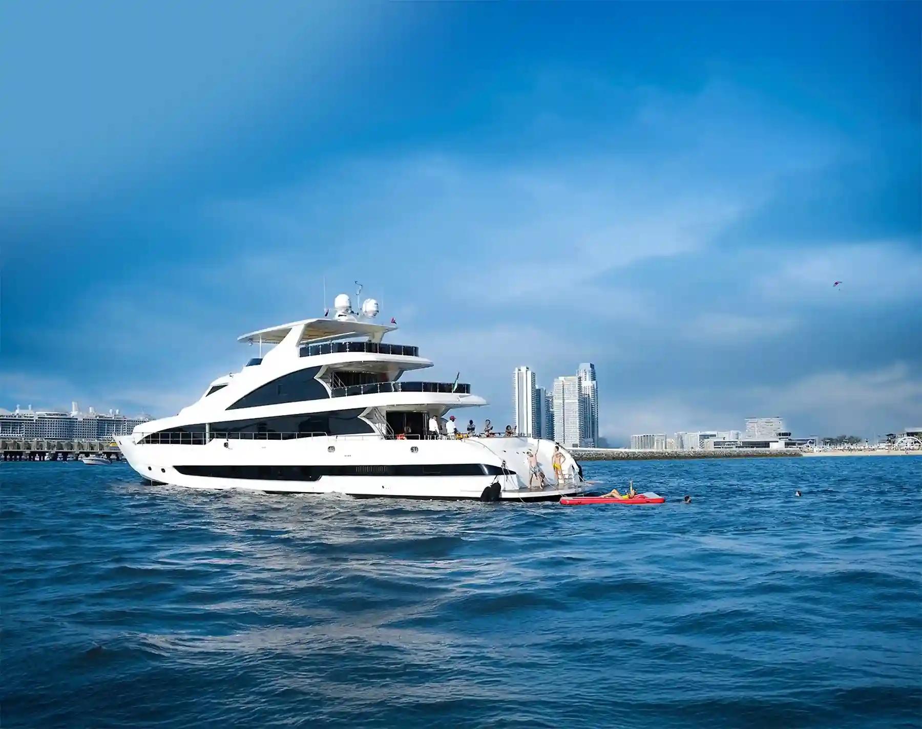 Luxury private yacht cruising along Dubai Marina skyline