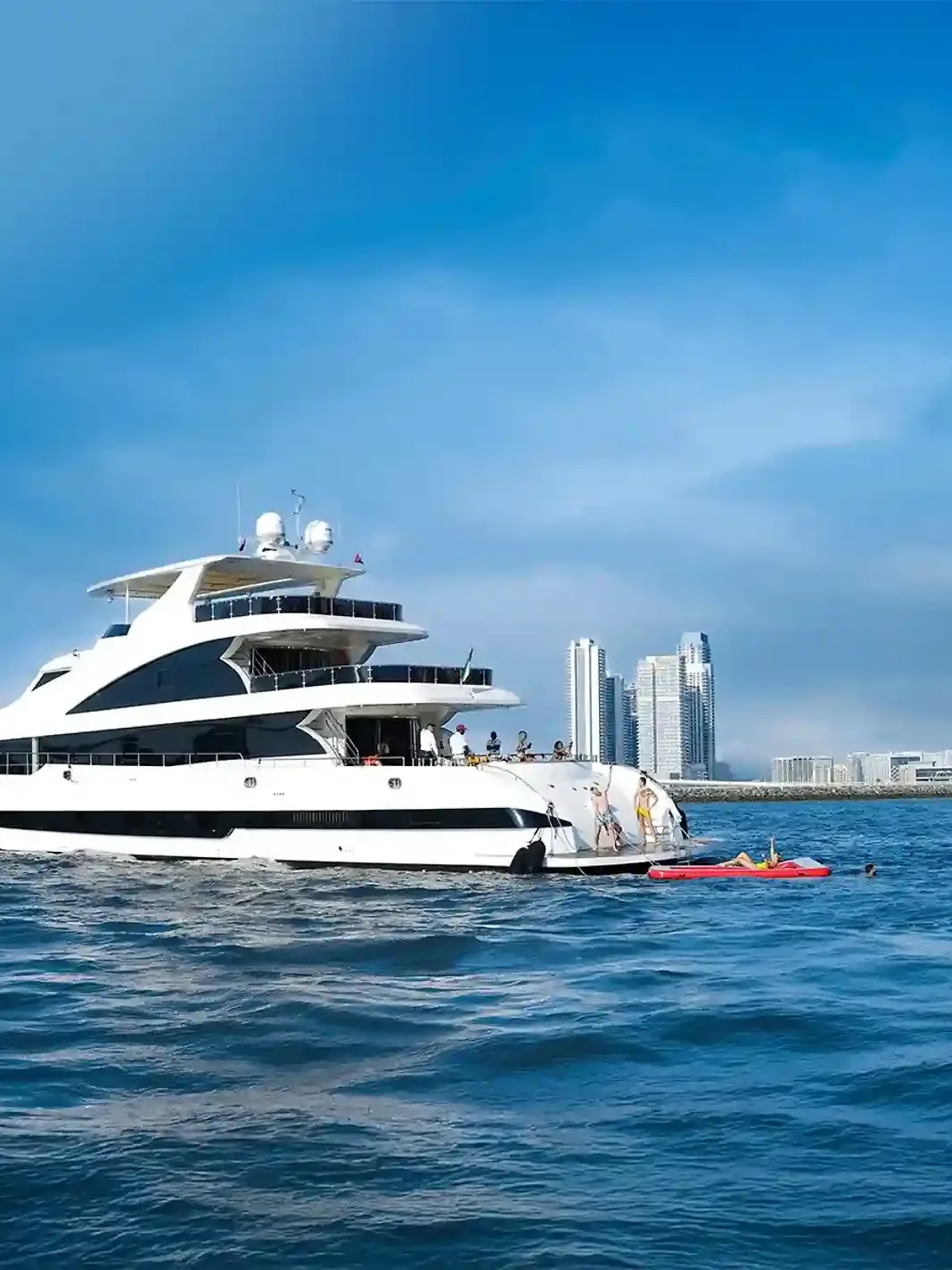 Luxury private yacht cruising along Dubai Marina skyline