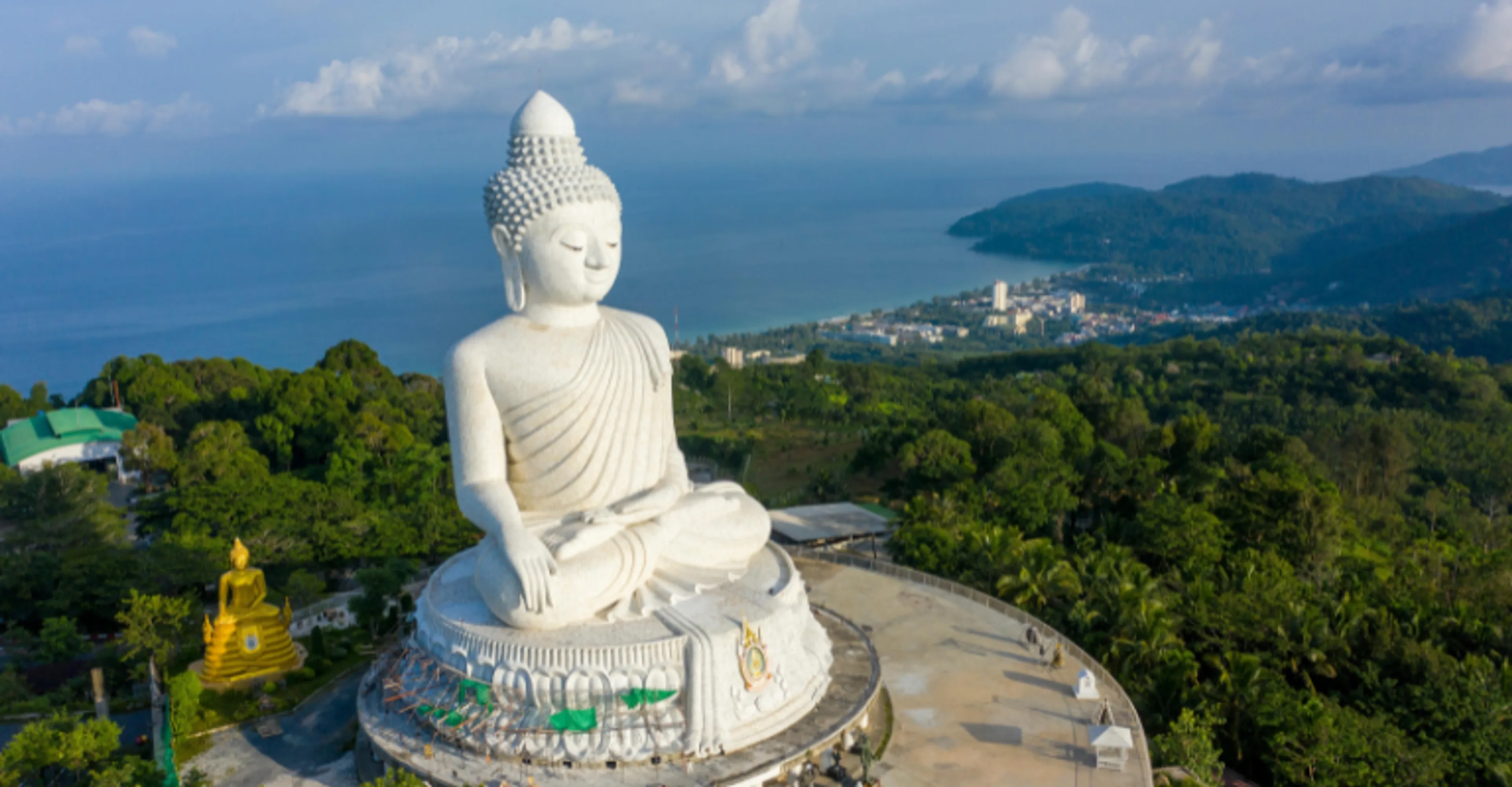 Big Buddha statue on a hilltop overlooking the coast in Phuket, Thailand