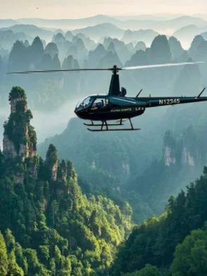 Helicopter flying over Guilin's limestone peaks, rivers and rice terraces