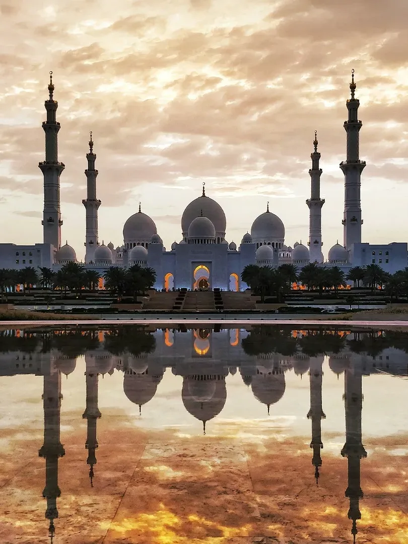 Sheikh Zayed Grand Mosque with white marble domes and reflective pools in Abu Dhabi
