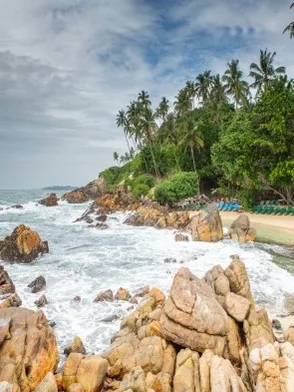 Surf-friendly shoreline at Weligama Beach in Sri Lanka