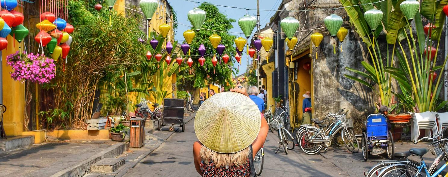 Colorful lanterns strung above Hoi An's ancient town streets