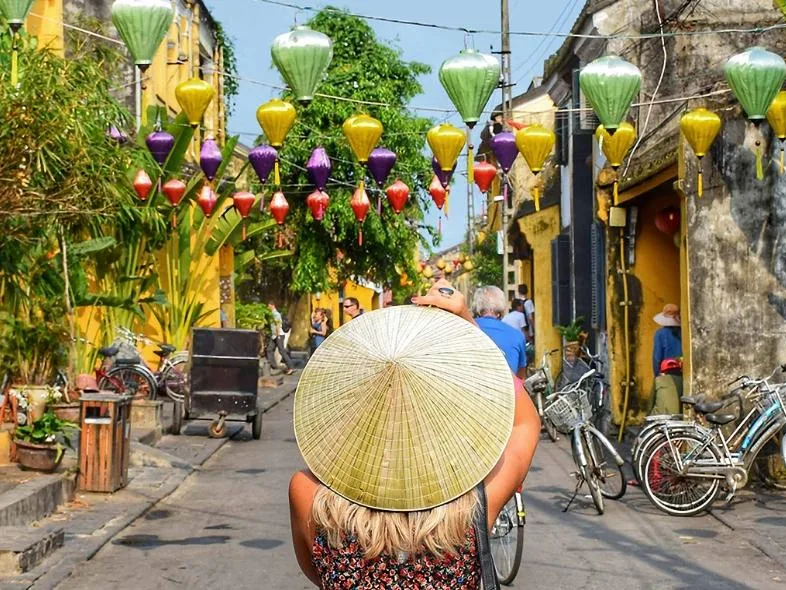 Colorful lanterns strung above Hoi An's ancient town streets