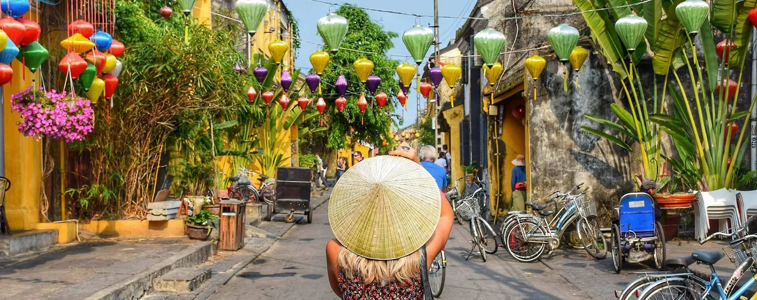 Colorful lanterns strung above Hoi An's ancient town streets