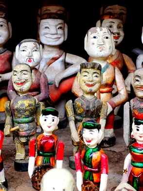 Traditional Vietnamese water puppet performance with colorful puppets on stage