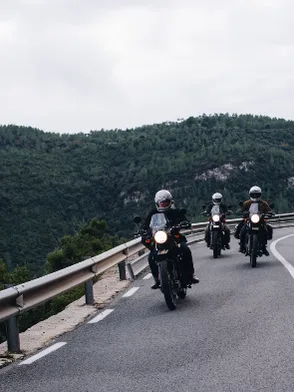 Motorbike riders on the winding mountain passes of the Hà Giang Loop Vietnam