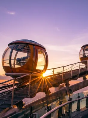 Visitors on the open-air Canton Tower Sky Walk observation deck overlooking Guangzhou skyline