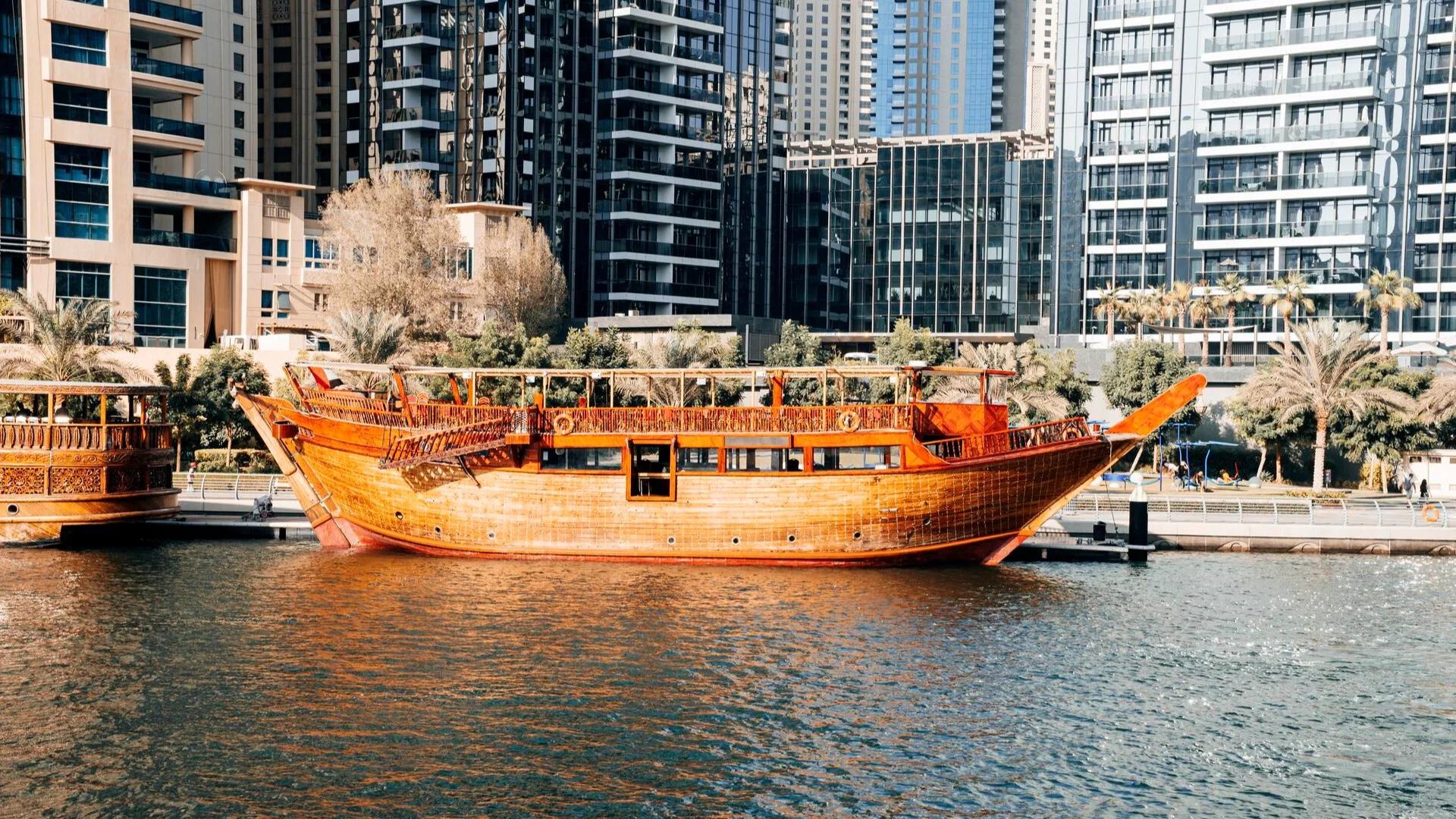 Wooden dhow boat moored at Dubai Marina.