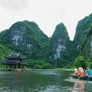 Scenic limestone karsts and river boats in Ninh Binh, Vietnam
