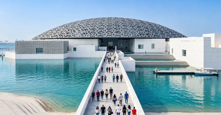 Visitors walking to the Louvre Abu Dhabi museum