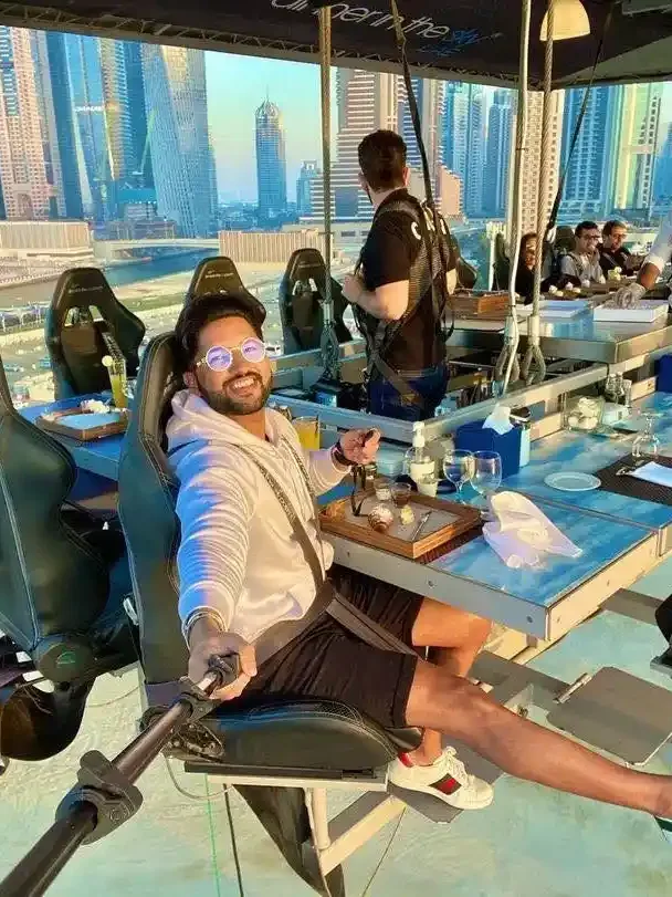 Guests dining on Dinner in the Sky experience overlooking Dubai skyline