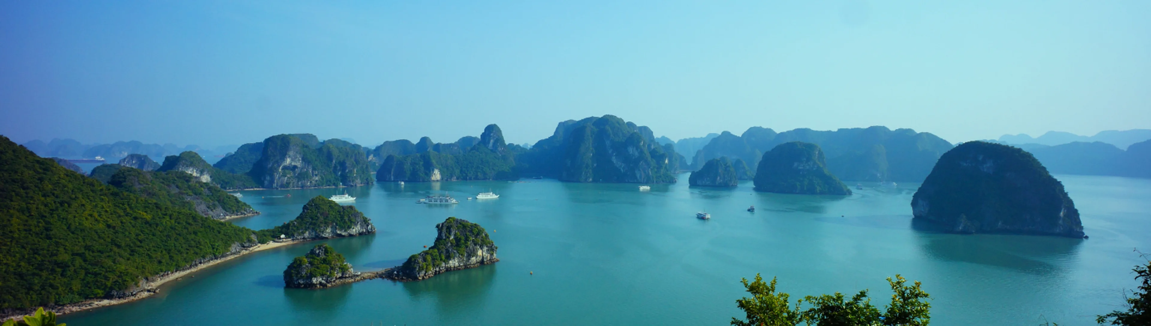 Unique experiences in Vietnam including Ha Long Bay cruises, Hoi An lantern streets, and cultural attractions